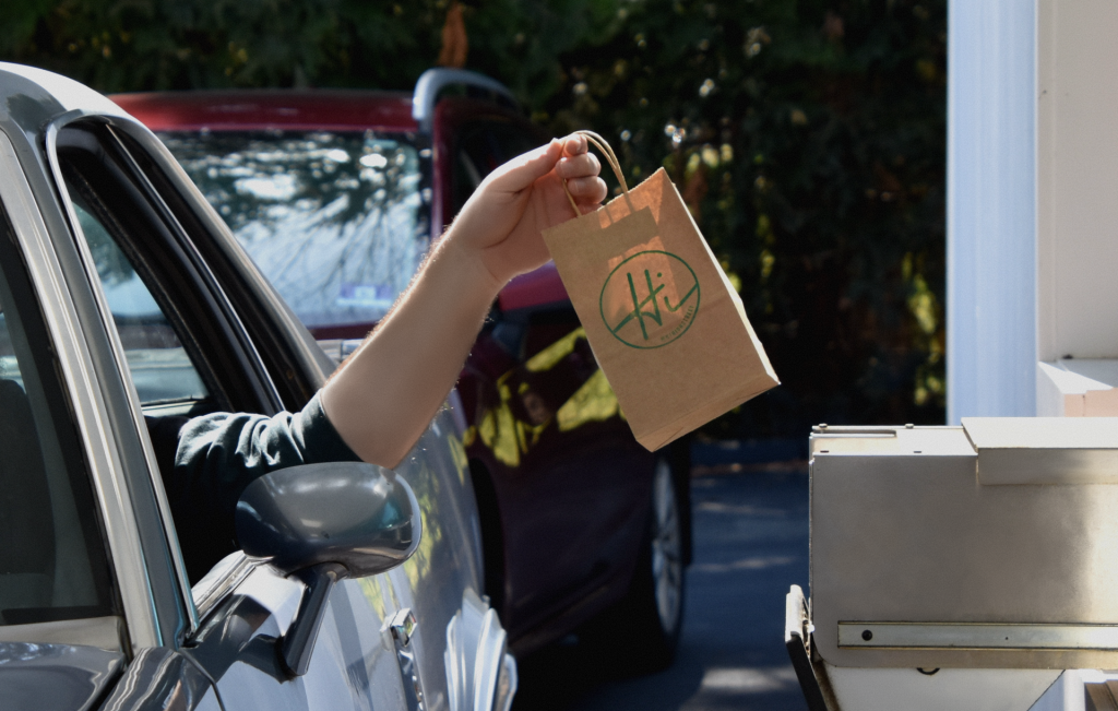 Man in car using the new drive thru option at New Jersey cannabis shop.